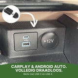 DriveLink adapter with arrow to USB-C and USB-A ports on car dashboard for wireless CarPlay and Android Auto