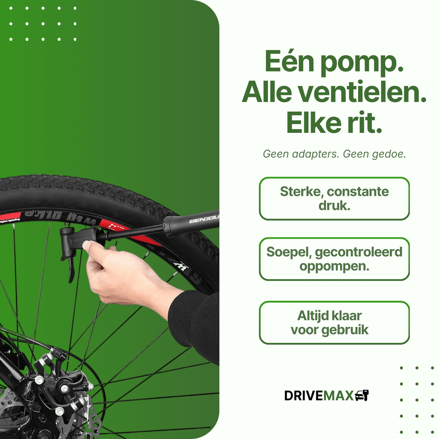 Hand using a black DriveMax bicycle pump on a mountain bike tire against a green background.