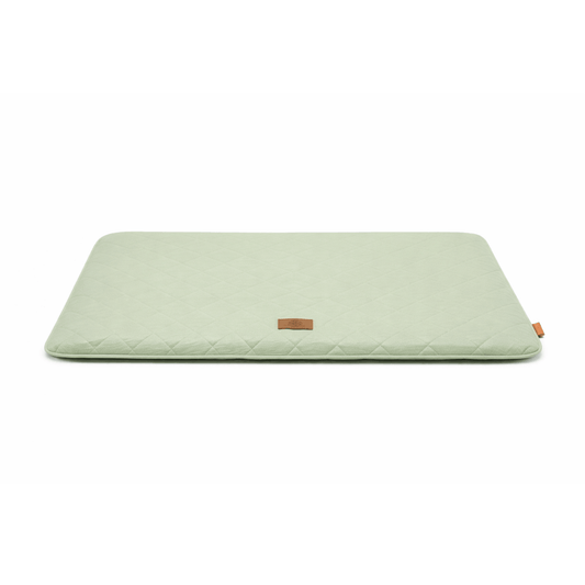 Green quilted dog seat cushion for car and home with rectangular shape for comfortable resting.