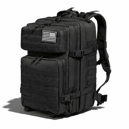 Black backpack with multiple compartments and buckles, photographed from a slanting front view.
